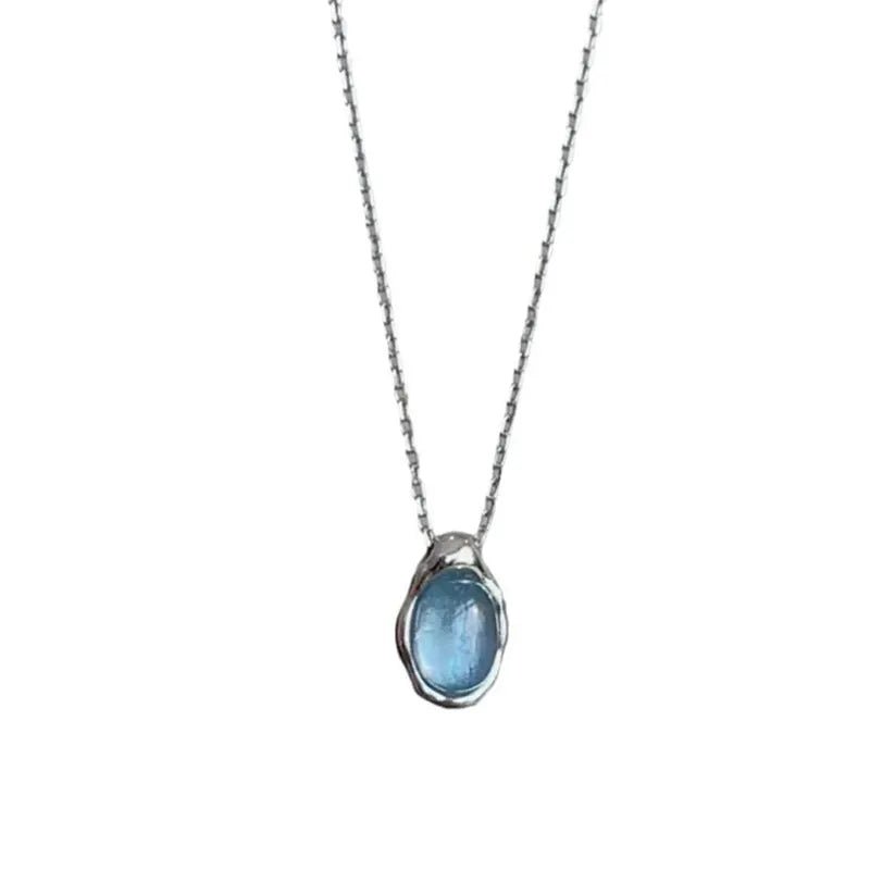 Navy blue geometric water drop pendant necklace on a cross chain, adjustable 41-50 cm.
