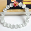Handmade glass bead bracelet with floral design in green, pink, white, or yellow.