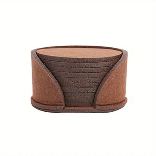10 round felt coasters in black, brown, dark gray, and light gray arranged on a dining table