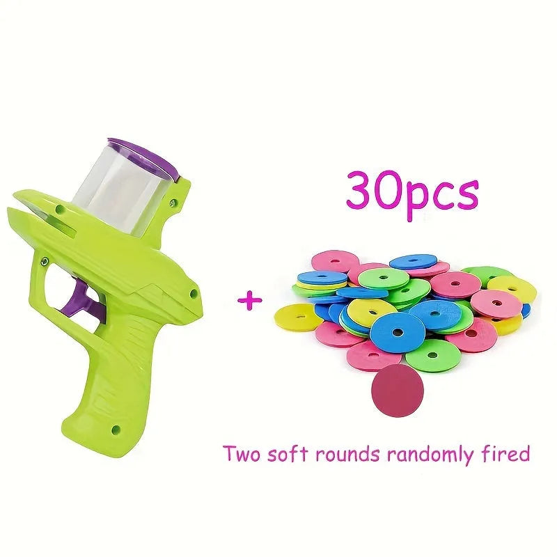 Green and purple battery-free interactive cat toy launcher with soft foam discs on a plain background