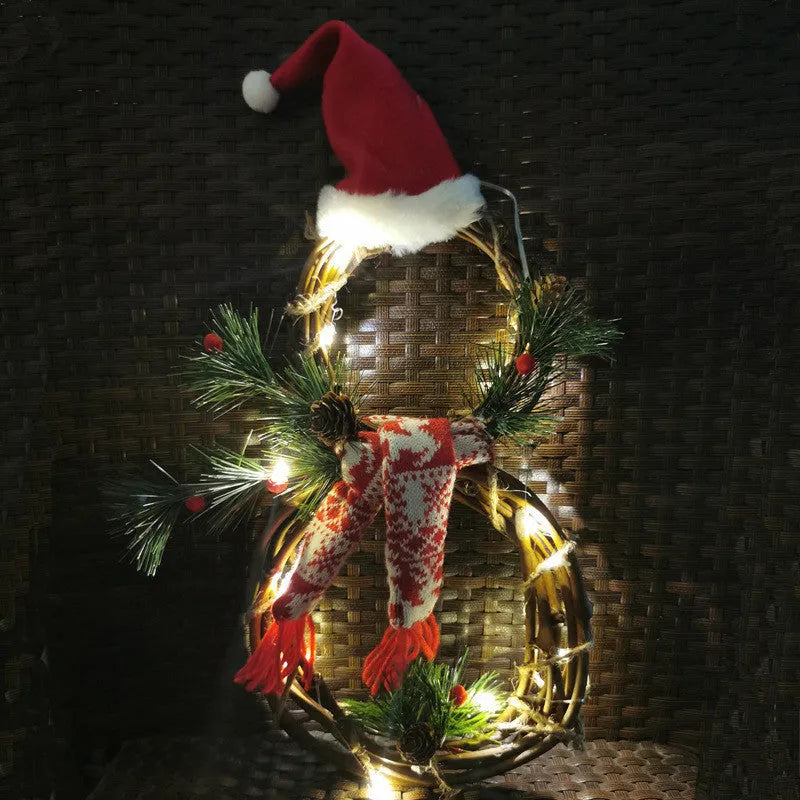 Christmas wreath made of pine needles on a vine circle base in red and grey colours for door decoration