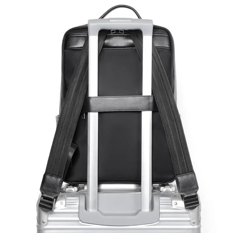 Black genuine leather computer backpack with 36-55 litre capacity and physiological curve back plate