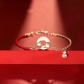 Japanese style festive koi bracelet with red rope, peace buckle, and electroplated finish for women