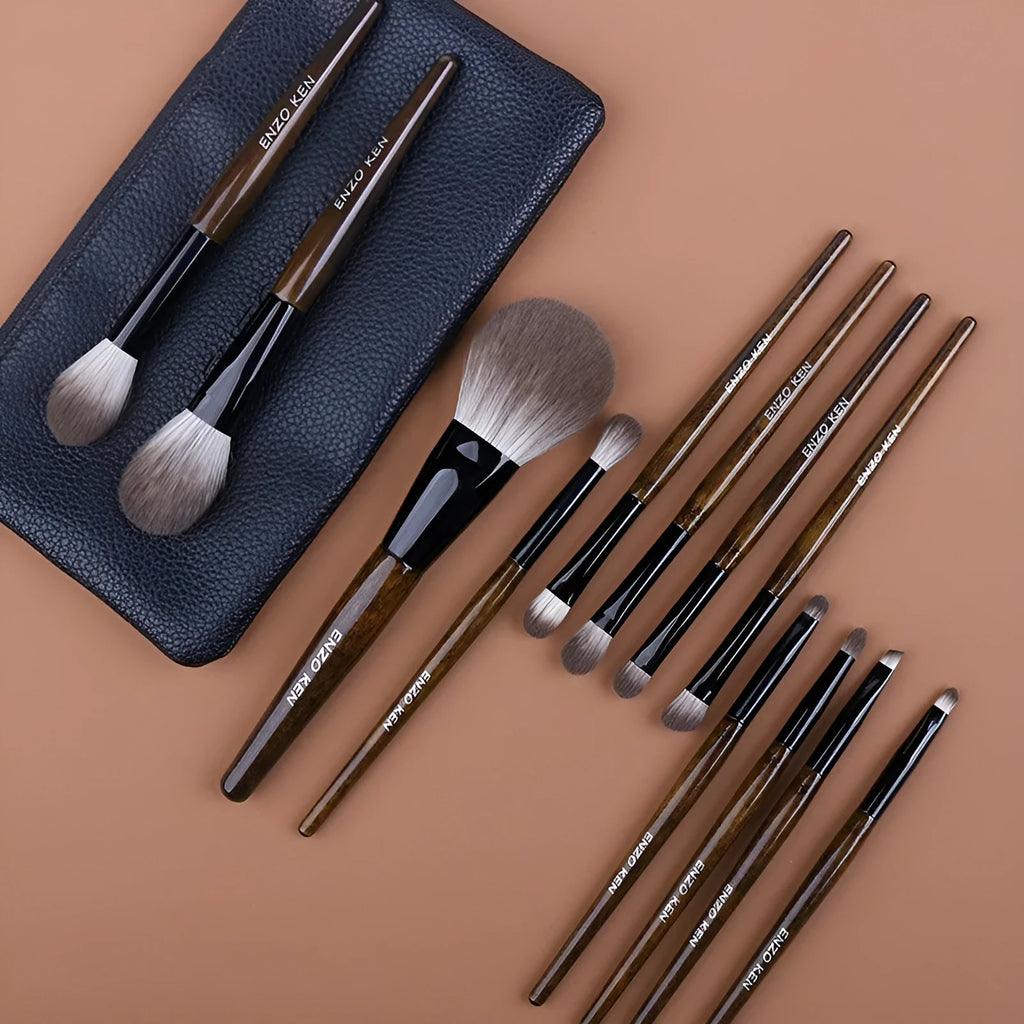 12-piece makeup brush set with wooden handles displayed in open PU brush roll