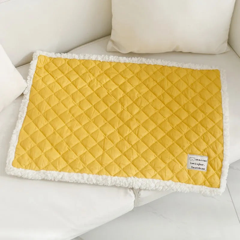 Soft blue terry cloth pet blanket for cats, shown on a pet bed, with size and colour options displayed.