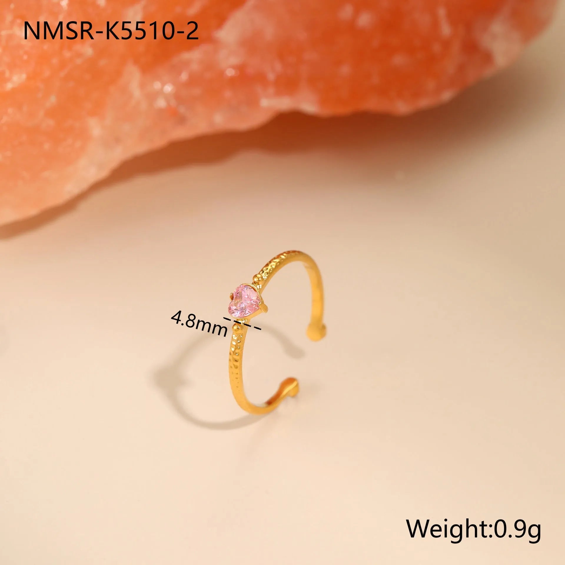 Open-ended stainless steel ring with a geometric design and a heart-shaped zircon inlay.
