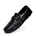 Men's leather brogue shoes in black with a belt buckle detail on a rubber sole