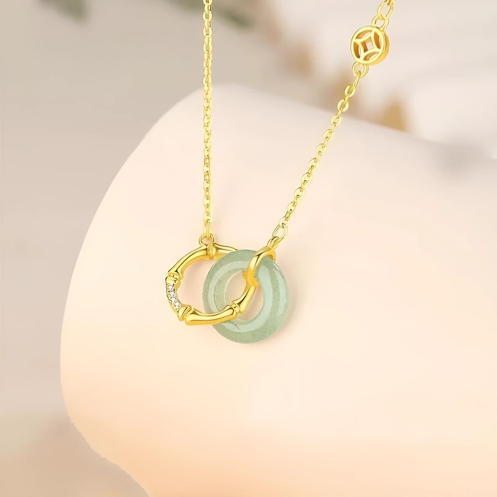 Handmade sterling silver necklace with a geometric bamboo joint peace buckle pendant on an adjustable chain.