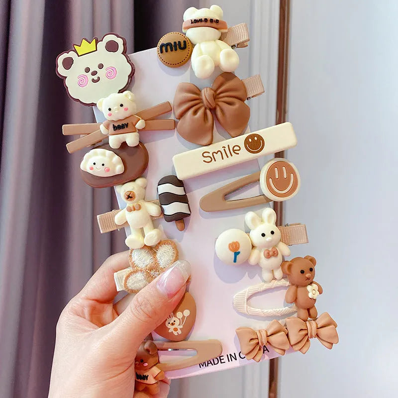 14-piece toddler hair clips set with rainbow barrettes, candy fruit, butterfly, and ice cream patterns on white background