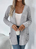 Solid colour long sleeve cardigan knitwear with front pockets in loose fit, available in black and granny grey