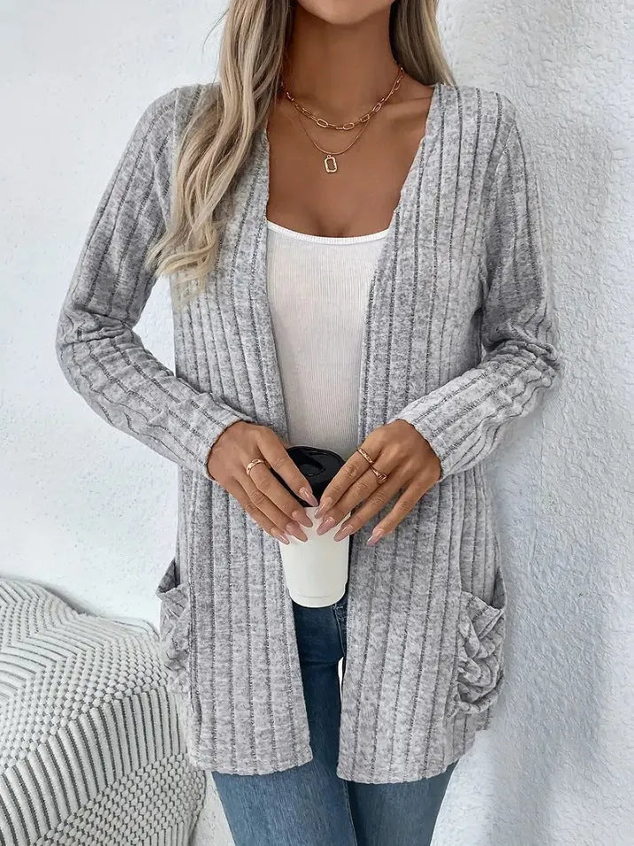 Solid colour long sleeve cardigan knitwear with front pockets in loose fit, available in black and granny grey