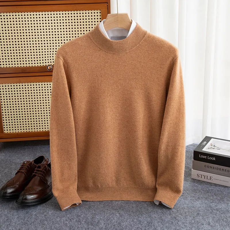 Man wearing a loose fit half-turtleneck wool sweater in a camel colour.