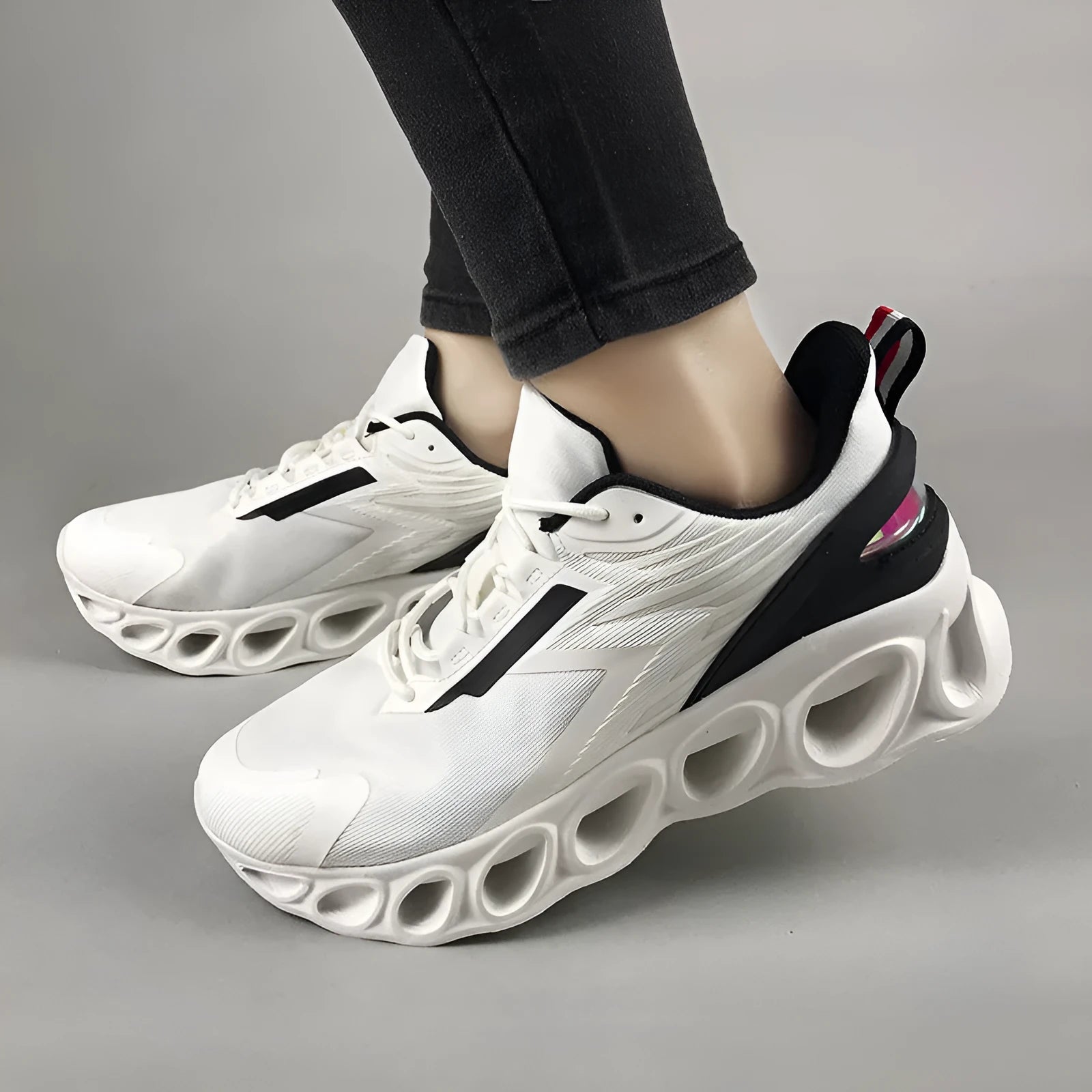 Men's low-top casual mesh trainers in black with lace-up front and round toe on a white background.