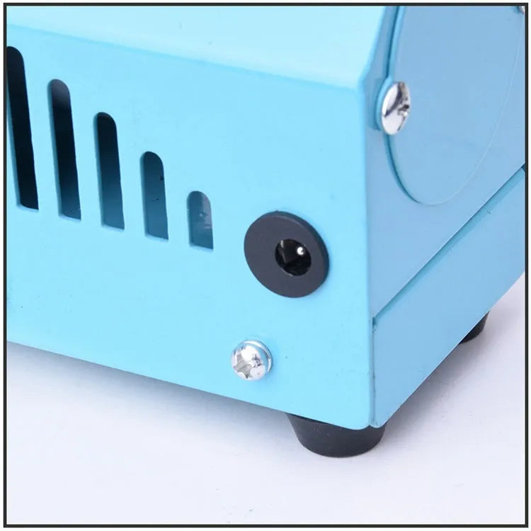 Mini DIY woodworking lathe in blue with protective cover, chuck, and accessories on a white background