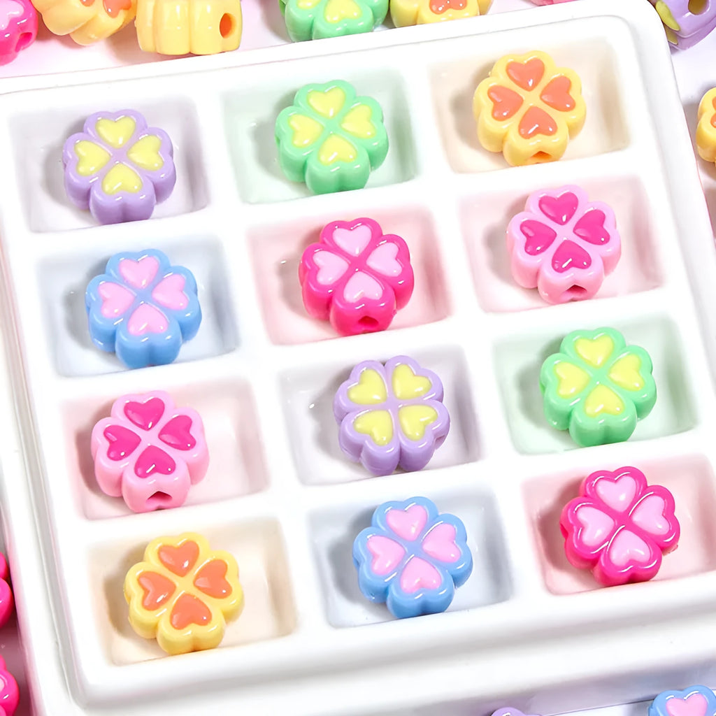 Assortment of 15mm frosted acrylic four-leaf clover beads in rose red, pink, yellow, green, blue, and purple.