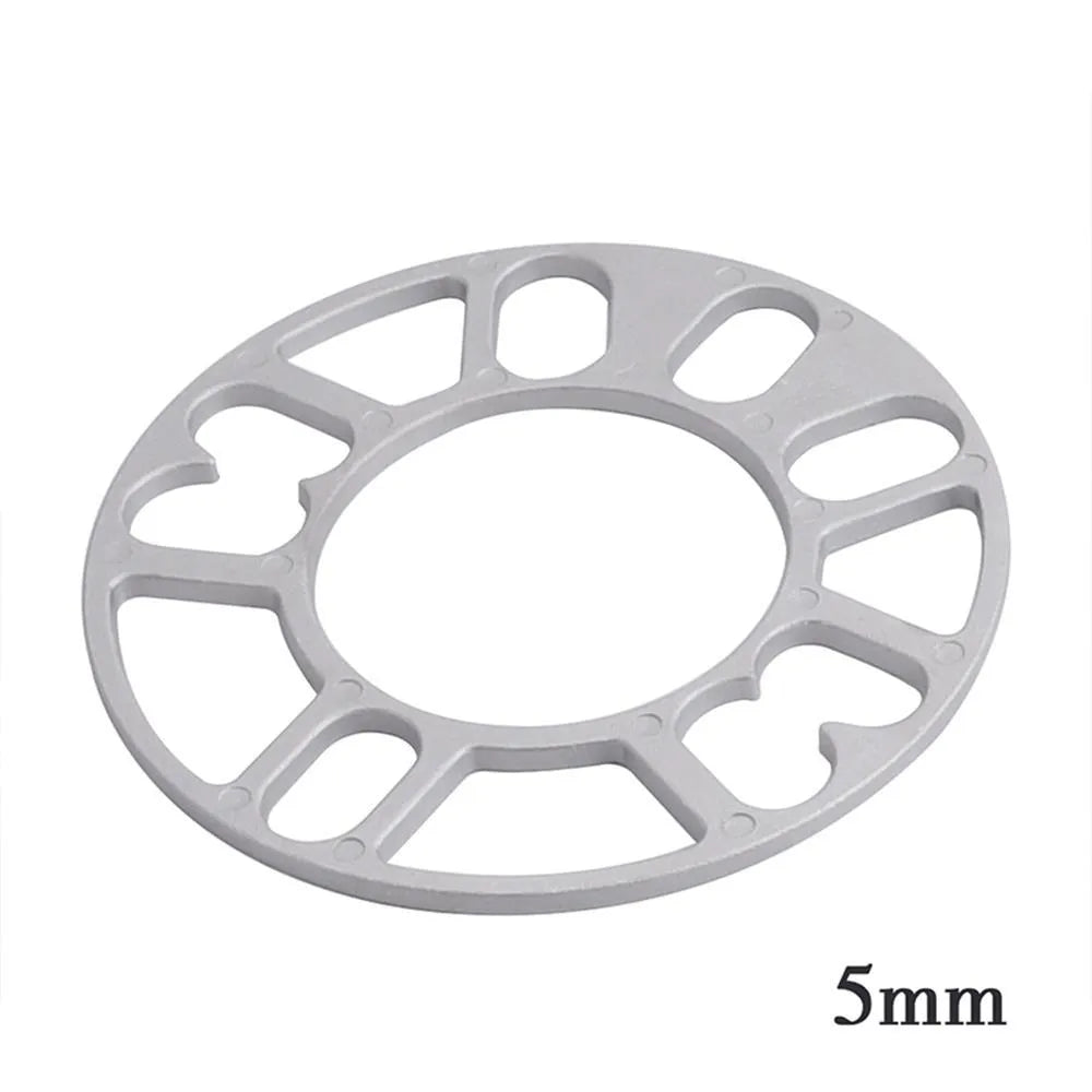 Set of four automotive wheel hub spacer gaskets showing different thicknesses of 3mm, 5mm, 8mm, and 10mm.