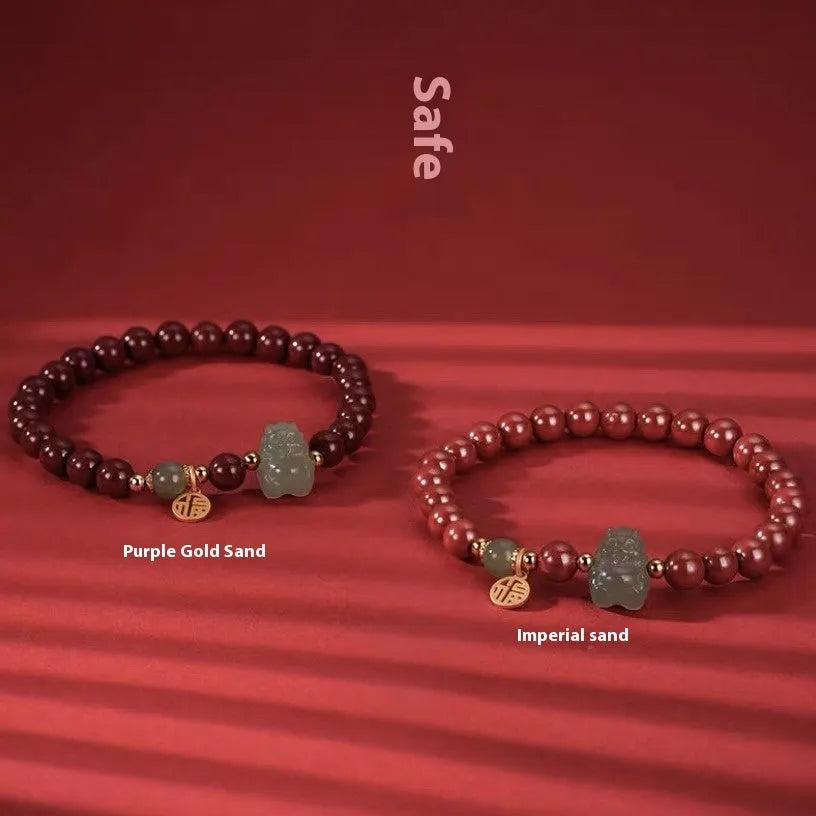 Natural Hetian Jade bracelet with animal modelling in Emperor Sandstone style.