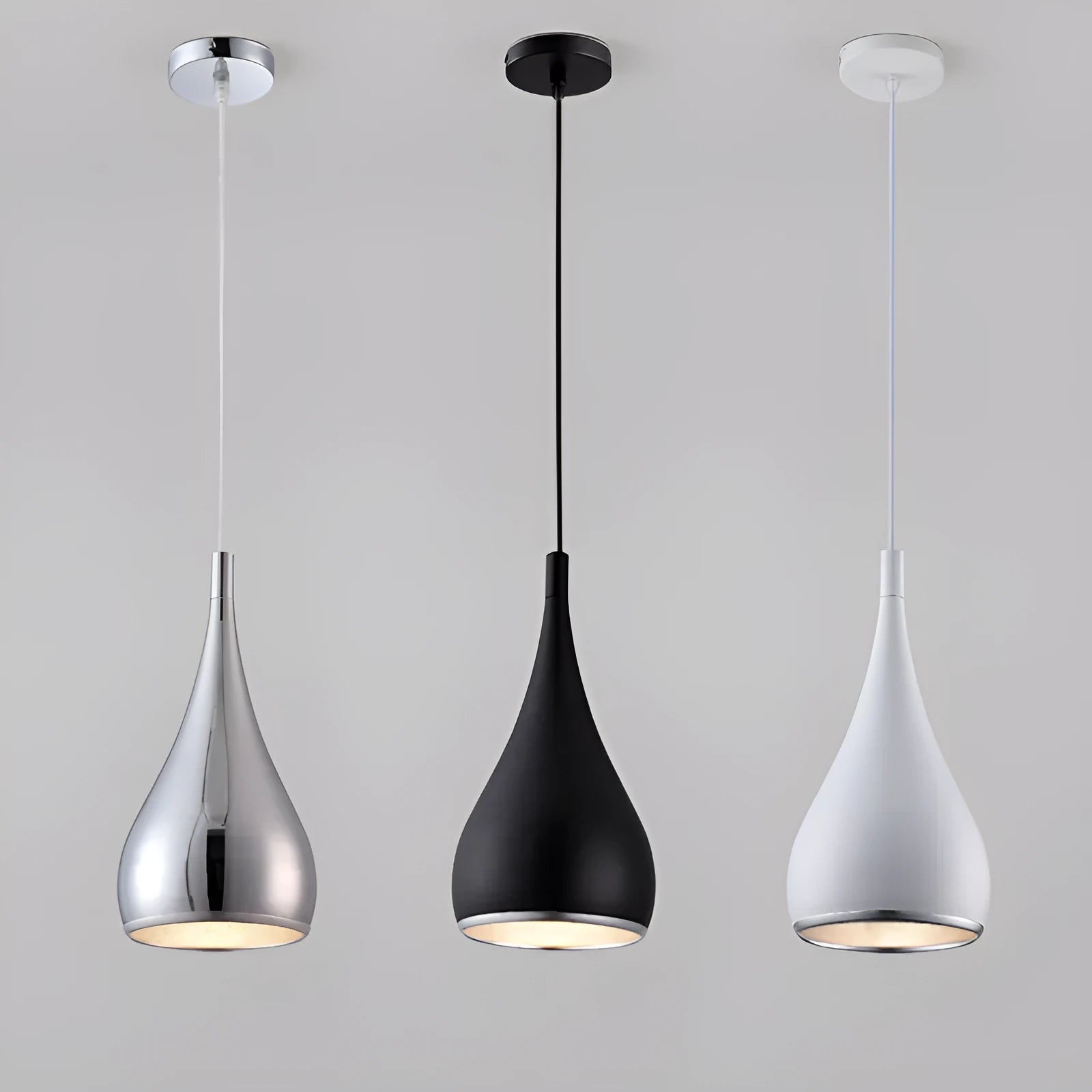 Minimalist black iron chandelier bedside lamp with three adjustable heads on a long platter.