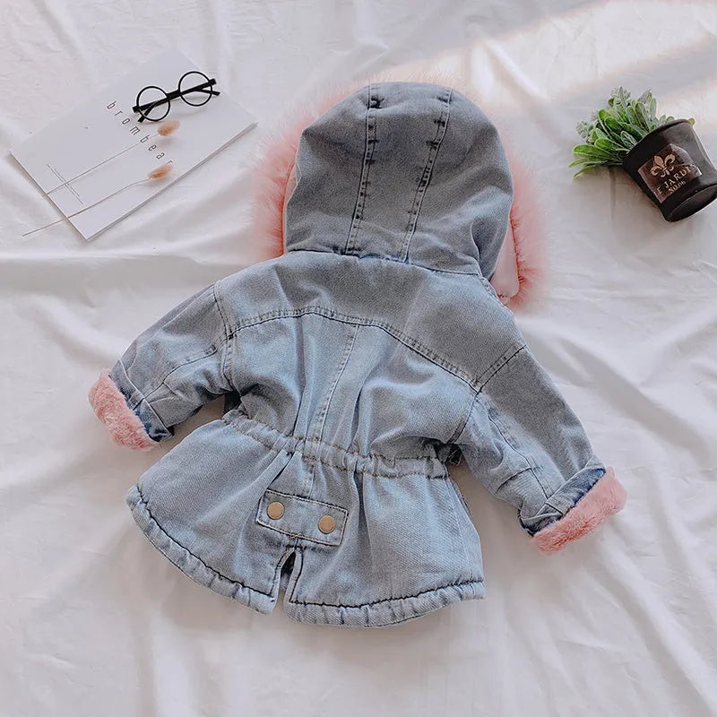 Blue denim coat for a young girl with a fleece lining and a non-removable hood.