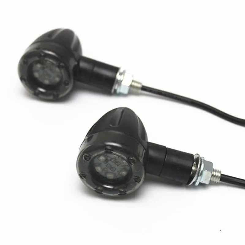 Pair of 6-LED motorcycle turn signals with smoke cover and black plastic housing, 8mm screw mount