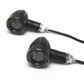 Pair of 6-LED motorcycle turn signals with smoke cover and black plastic housing, 8mm screw mount