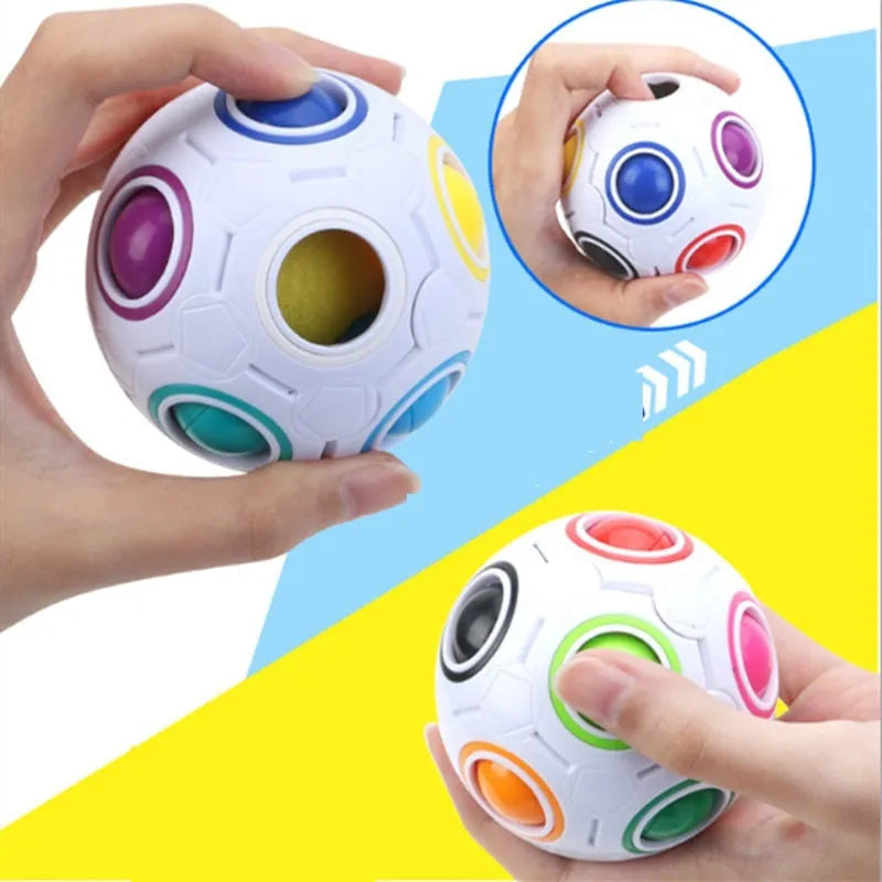 Colourful rainbow ball puzzle toy with visible holes, 5.5 cm in diameter.