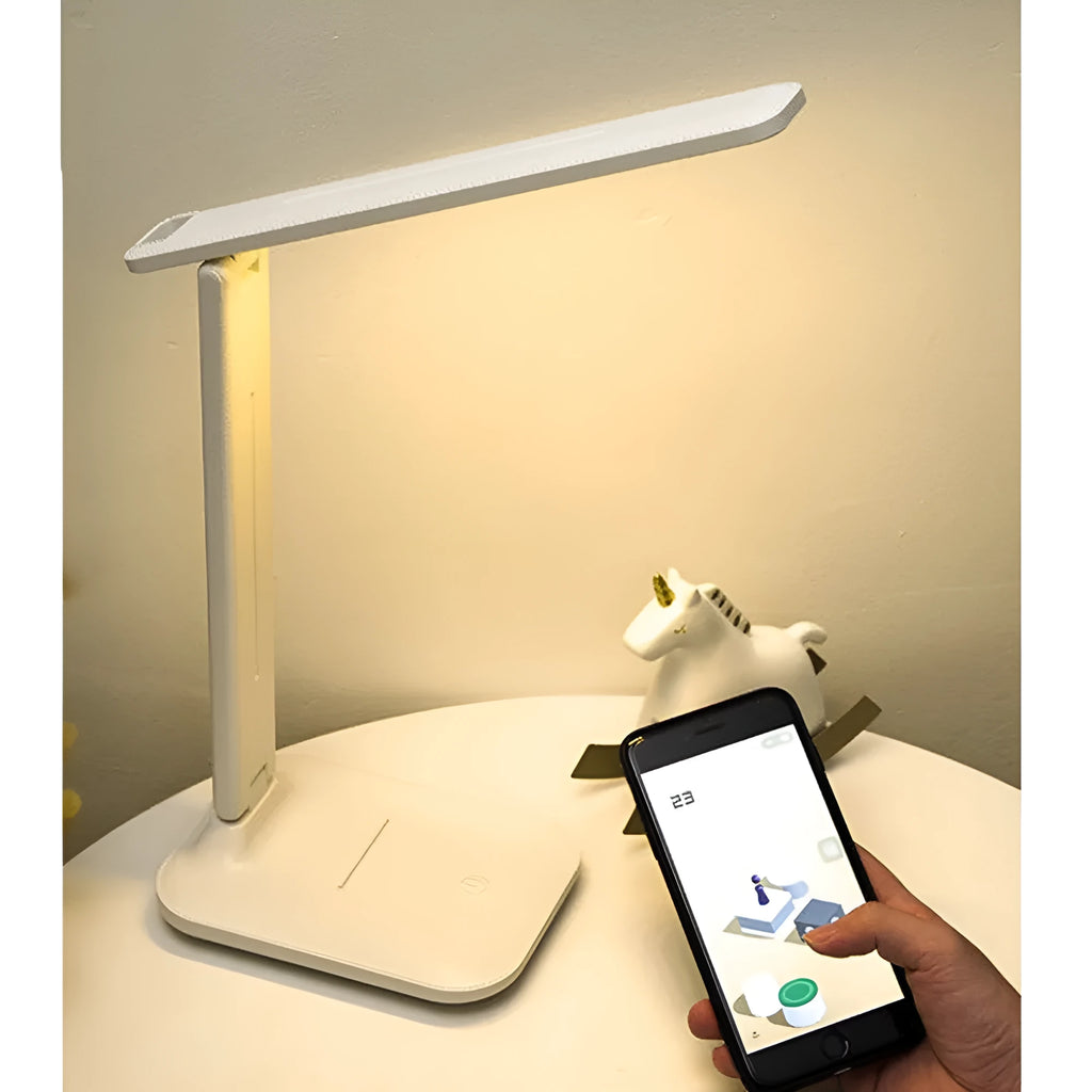 White plastic children's bedside lamp with touch dimming controls and USB charging port