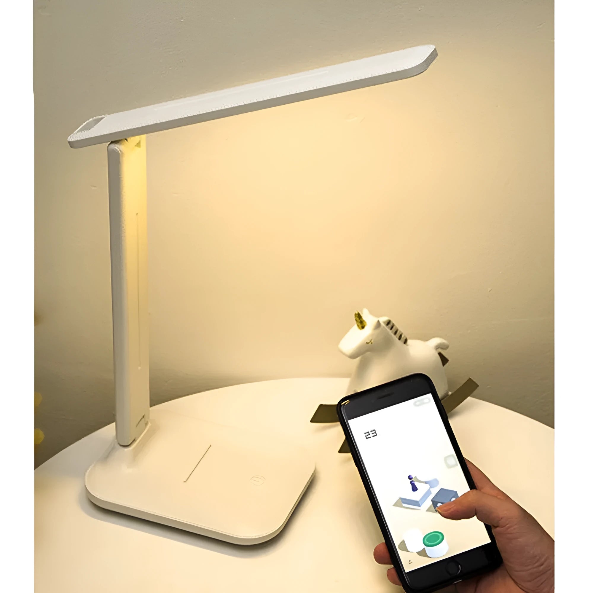 White plastic children's bedside lamp with touch dimming controls and USB charging port