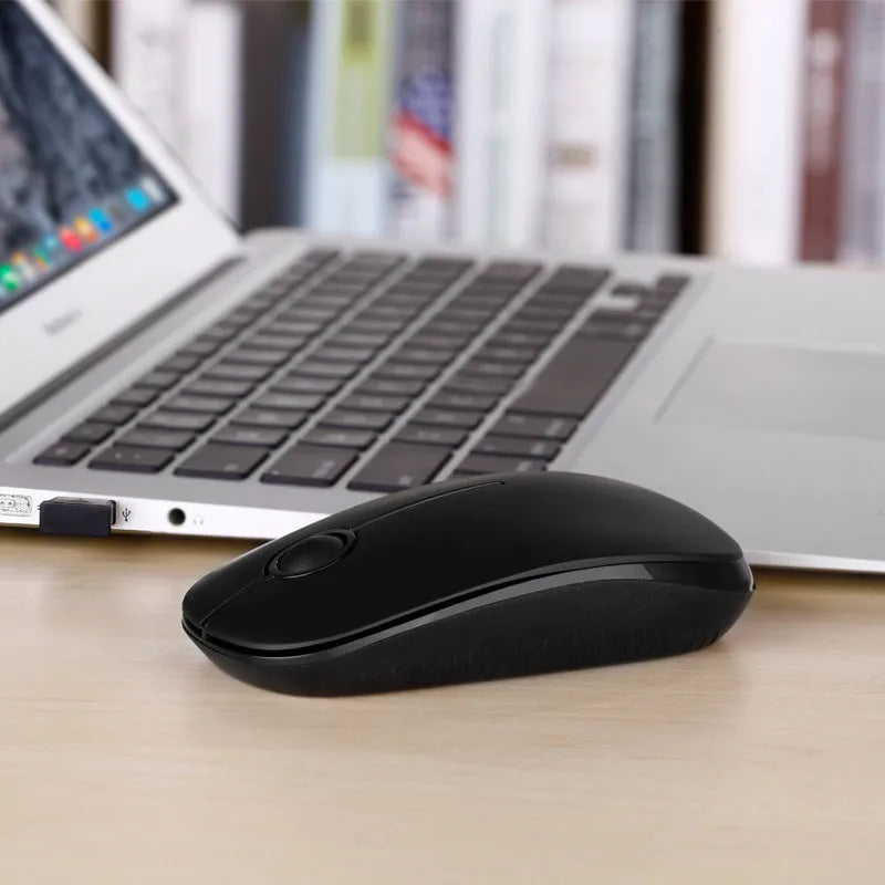 2.4G wireless mouse in black with compact design on flat surface