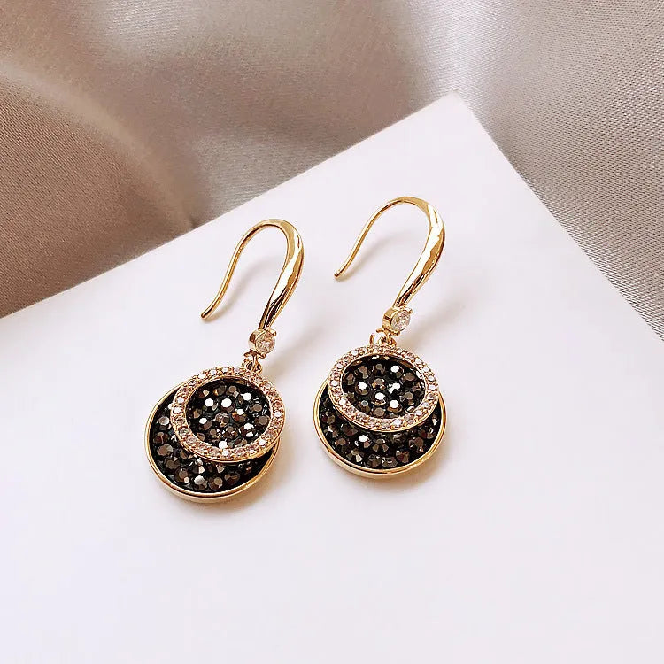 Black geometric alloy earrings with circular design measuring 3.6 cm in length