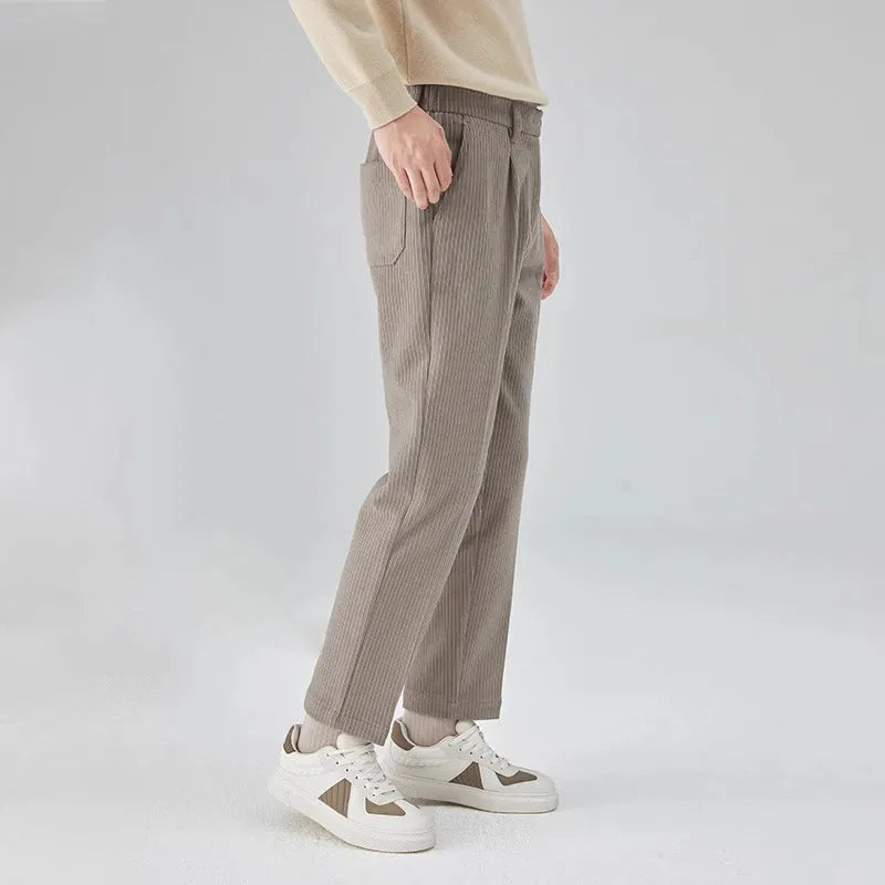 Men's straight-leg corduroy trousers in beige colour showing mid-waist design and loose fit