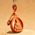 Eight patron saint keychains in natural Taomu wood, peach wood colour, 10x3.2x4cm size, orange colour option available