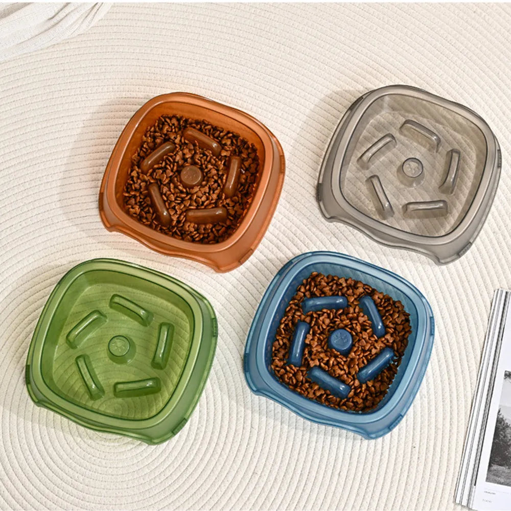 Blue plastic slow feeder dog bowl with internal ridges to prevent choking.