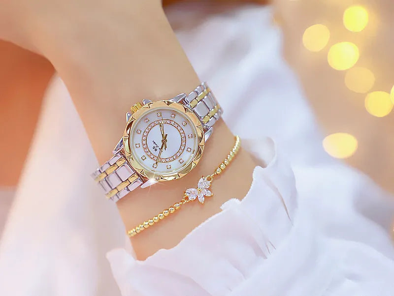 Women's quartz watch with 32mm round dial, alloy case, and mineral glass in a choice of gold or silver finishes