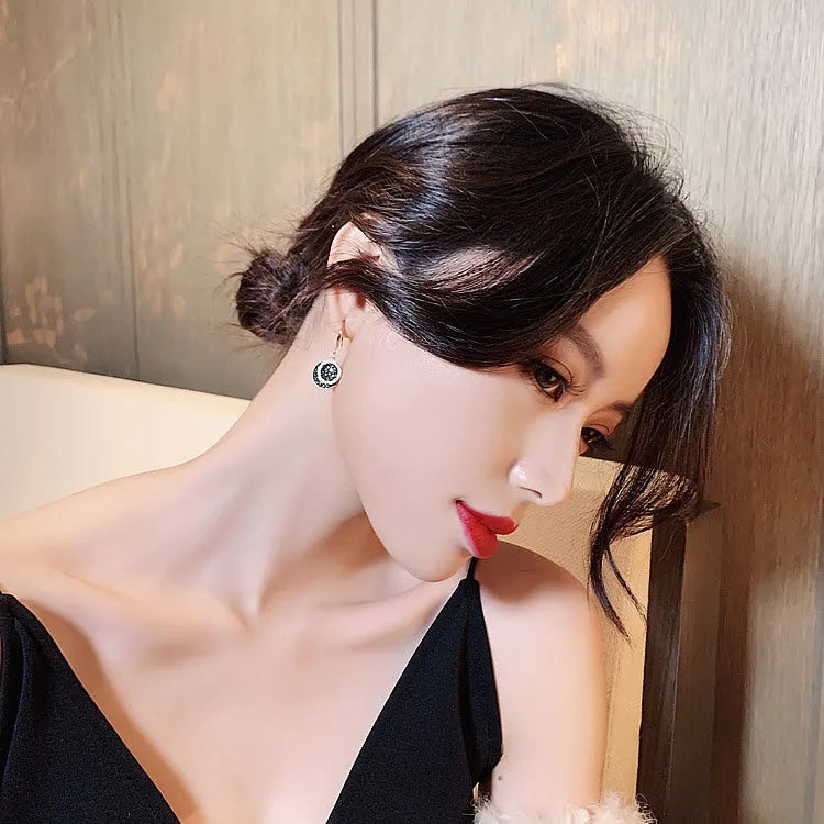 Black geometric alloy earrings with circular design measuring 3.6 cm in length