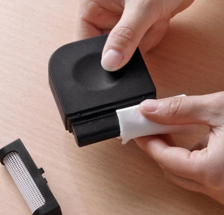 Portable manual clothes cleaning brush with removable catching net on a sweater