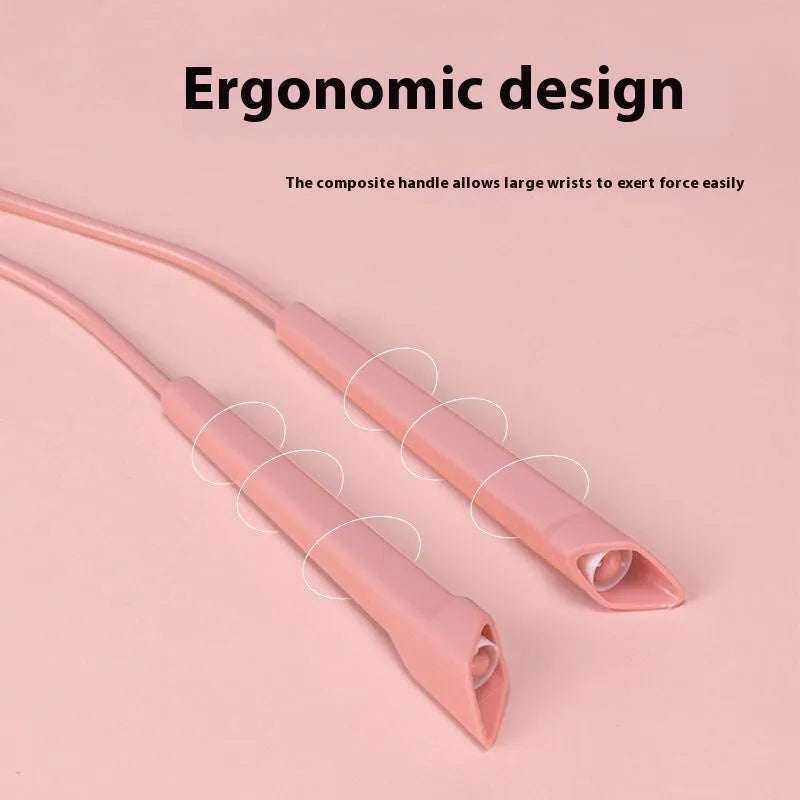 Fitness skipping rope with blue plastic handles and a coiled PVC cable on a grey background.