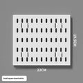 White punch-free plastic cable organisation board mounted on a wall with wires neatly wrapped.