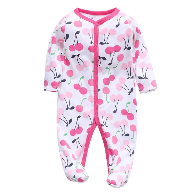 Cotton baby one-piece romper in a dinosaur print style for infants, showing size options from 3 to 12 months.