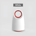 Black or white silent USB electric mosquito killer with UV light on a table.