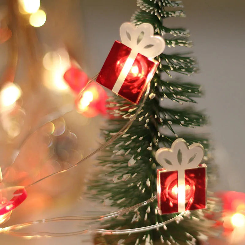 30 warm white LED copper wire string lights with 2 metre length and battery box, six festive shapes on display