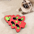 Green Christmas tree interactive dog puzzle slow food bowl with non-slip base on wood floor