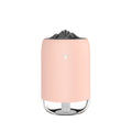 Compact cylindrical mini USB humidifier in turquoise green with a single mist outlet and night light.