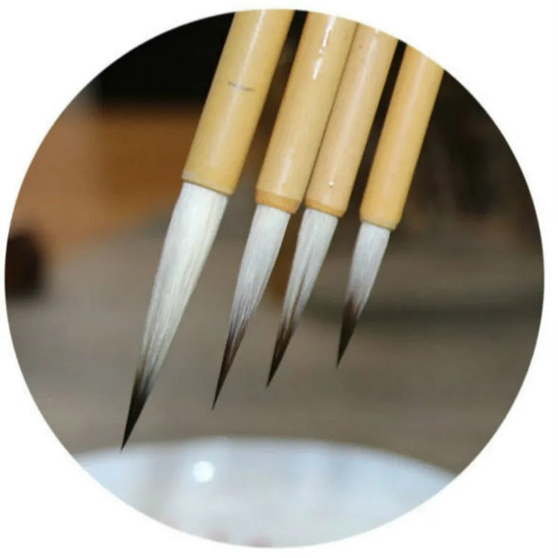 Set of four thin gold body wolf wool hook thread writing brushes for Chinese calligraphy.