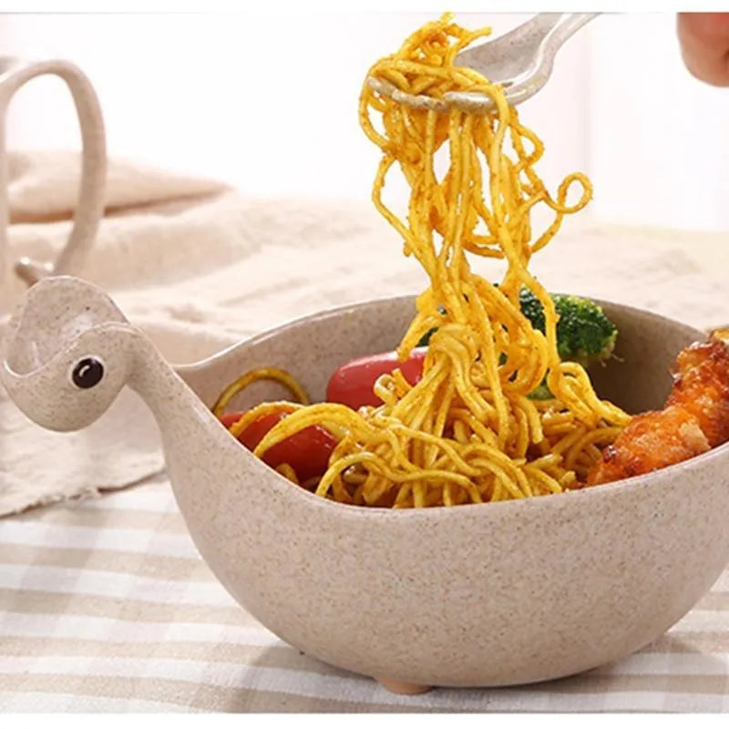 Cute tiny dinosaur bowl made of natural wheat straw fibre in pink, green, and beige colours, lightweight non-slip unbreakable design