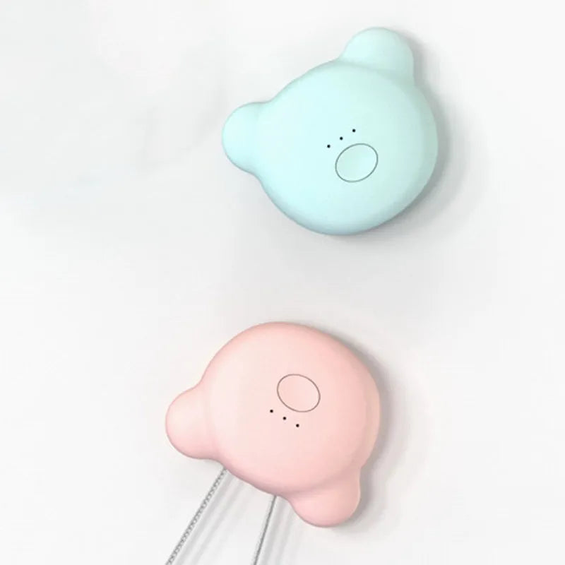Mini USB portable air purifier necklace in blue, shown worn and with USB cable.