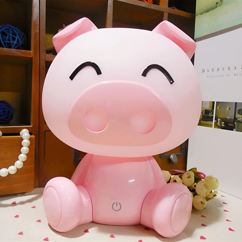 Cartoon pig small night lamp in blue showing soft LED glow, ABS body with USB power connection