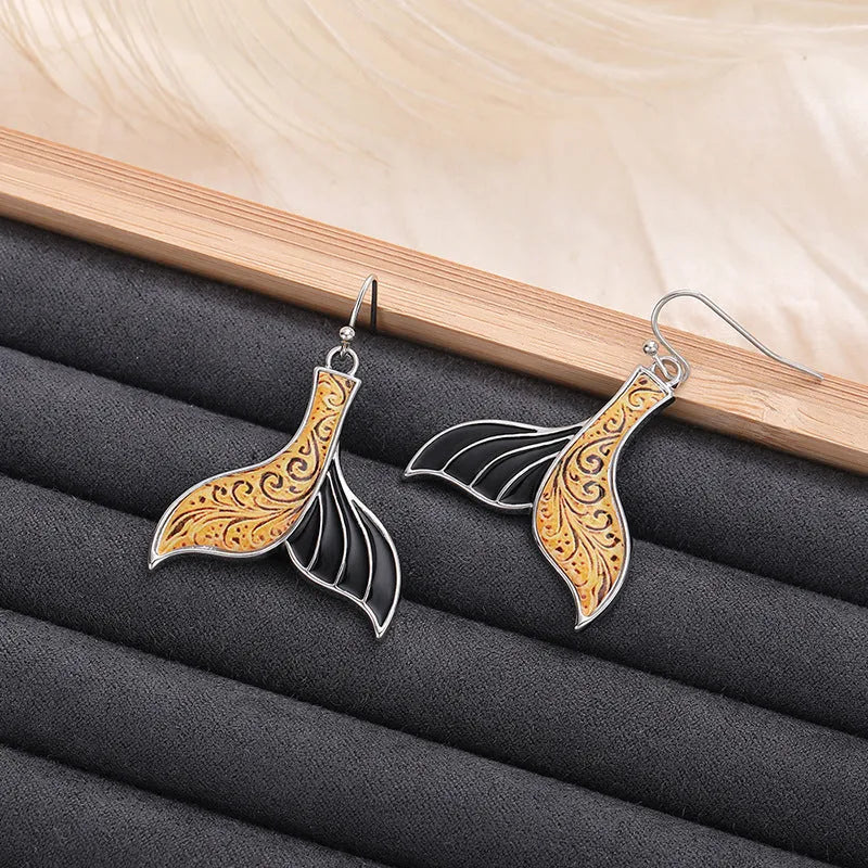 Women's retro whale design fishtail earrings in white gold alloy with distinctive animal-inspired jewellery styling