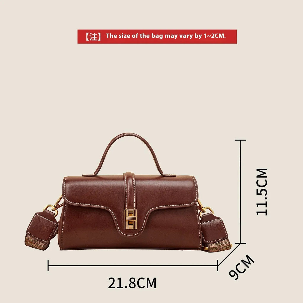 Niche retro Cambridge messenger bag in brown cow leather with lock detail and clamshell opening