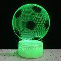 3D football-shaped LED night light on a black base showing multi-colour gradient illumination.